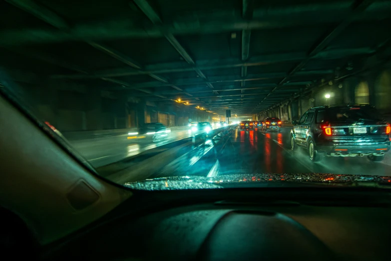 the interior of an auto being driven in traffic