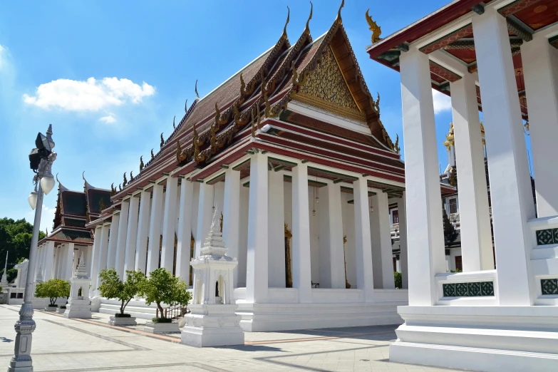 rows of pillars in front of white building