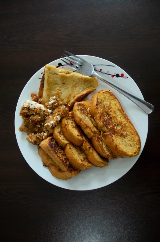 a plate with toast and other food on it