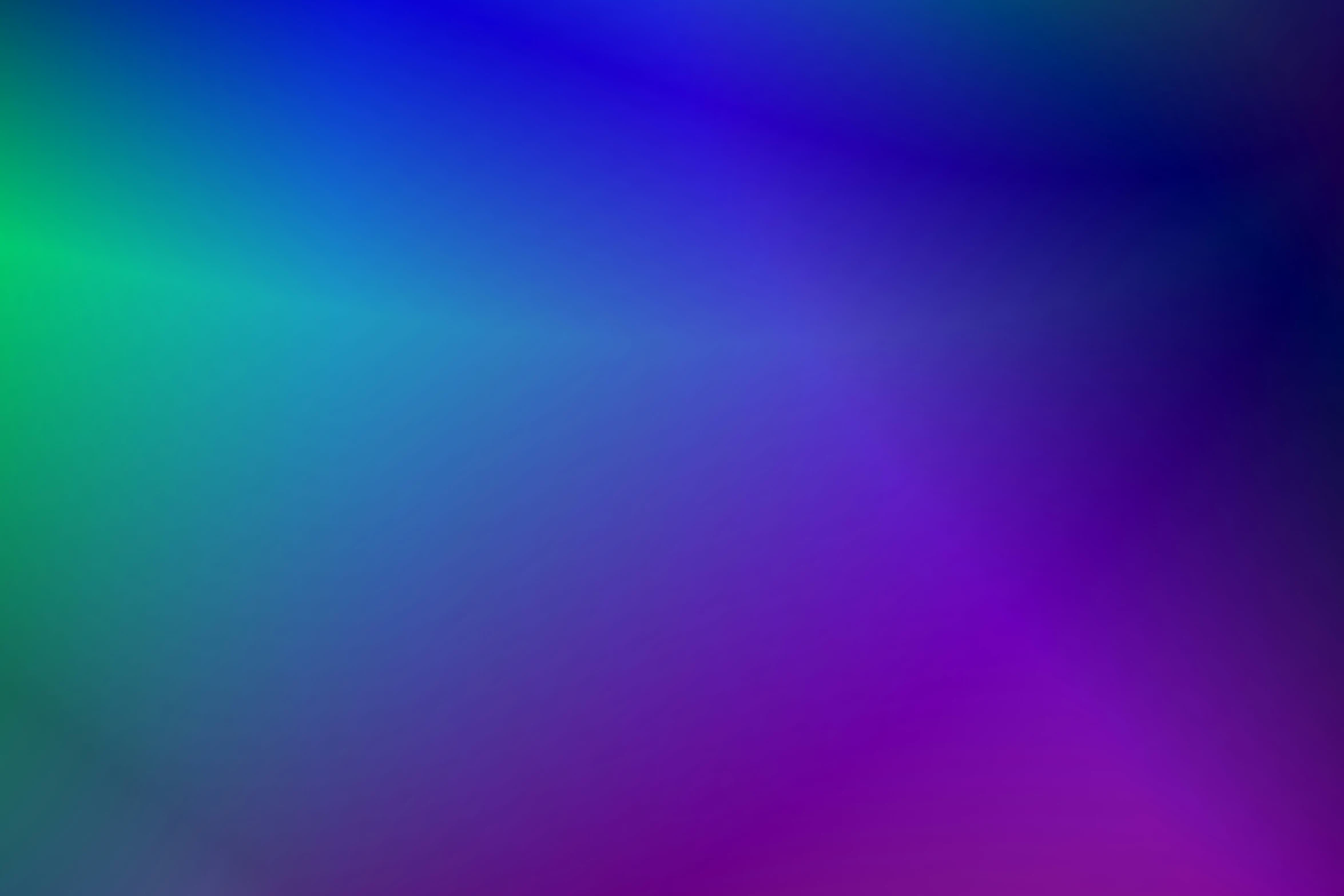 multi - color blurred image of purple, green and blue