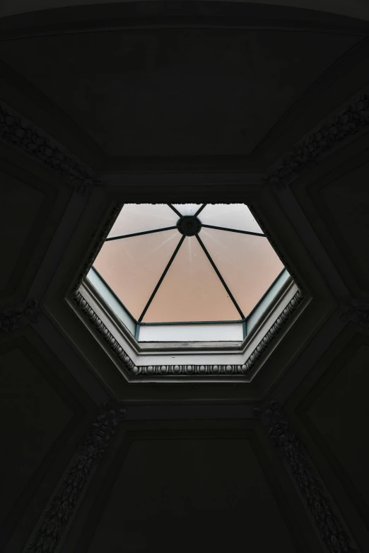 a glass domed ceiling in a dark room