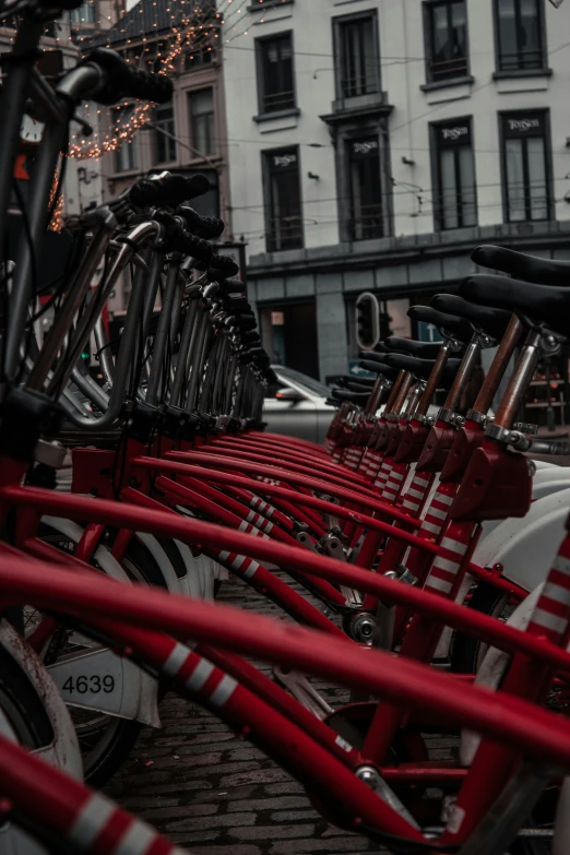 a line of bicycles parked next to each other