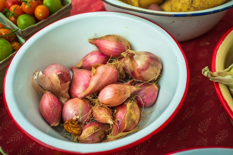 a bowl full of onions sitting on top of a table