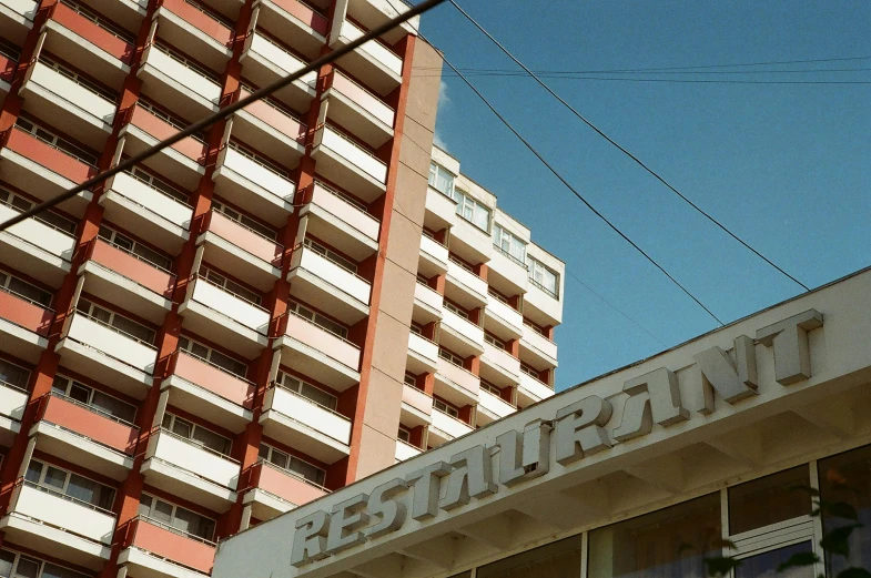 a tall building with a sign next to it