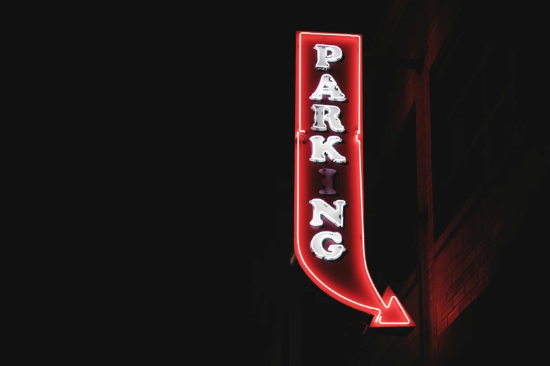 the lighted sign for a parking garage