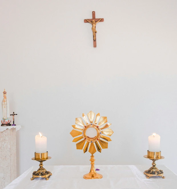 an altar with a cross and a cross in the background