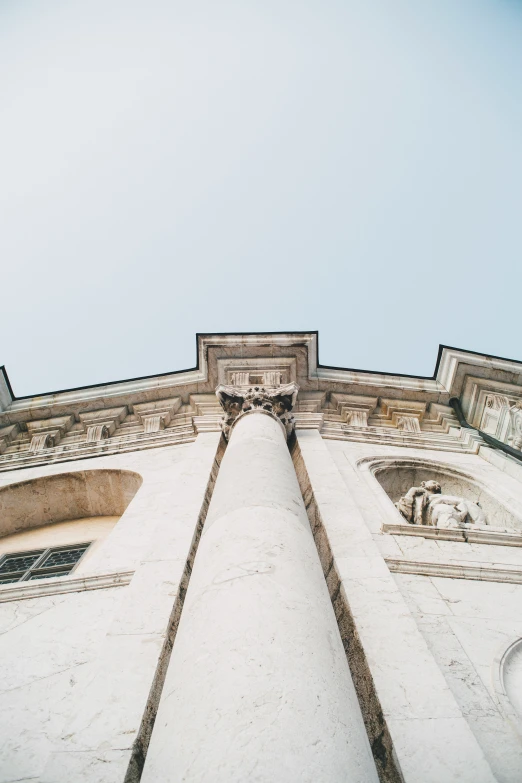 a po taken from the ground looking up at an old building