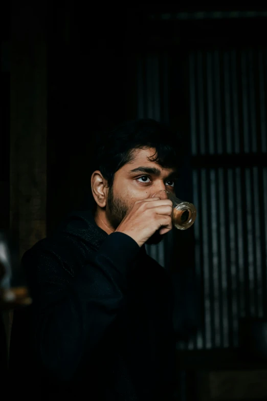 a man smoking and looking ahead with an open mouth