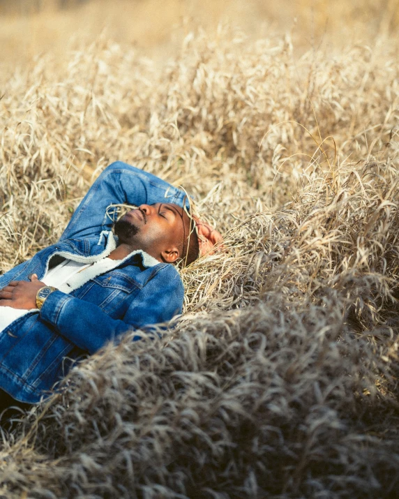 a person laying in the grass looking up