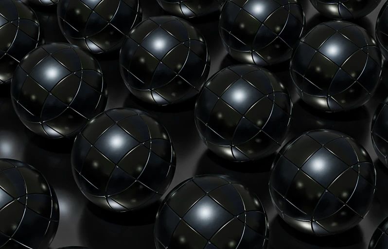 many spheres sitting next to each other, both black and silver