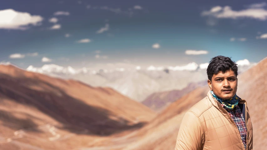 man standing in front of mountains during daytime