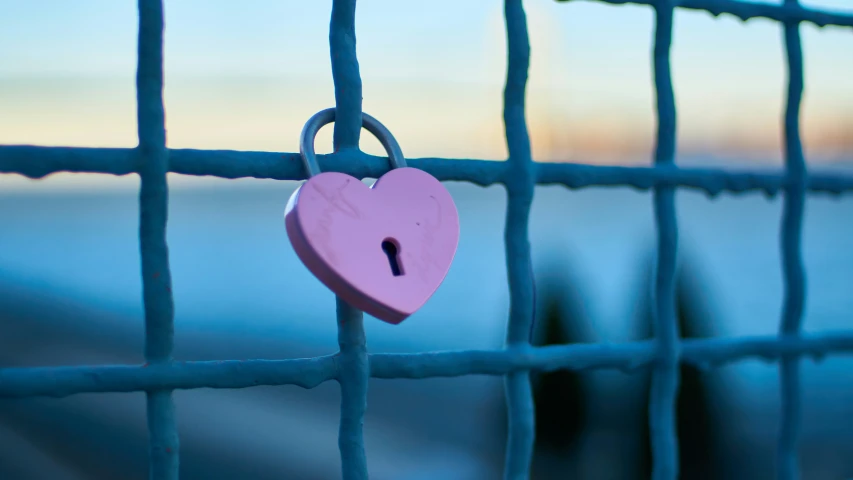 a couple of keys that are on the side of a fence