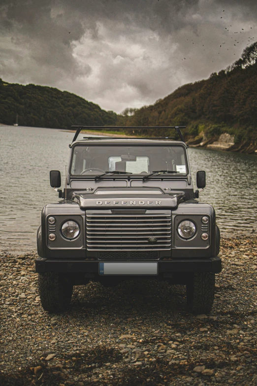 a very nice looking land rover on the beach