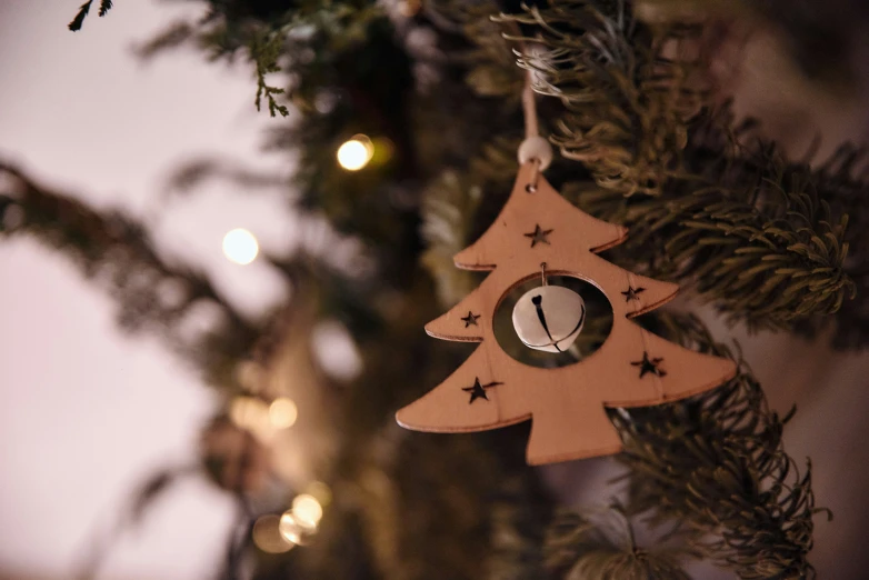 there is a small christmas tree ornament hanging on the nch