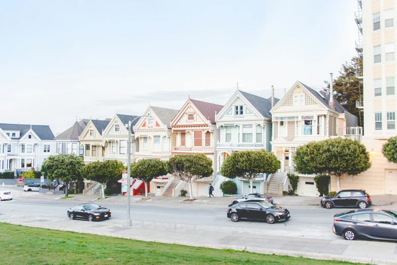 a row of colorful houses sitting on top of a street