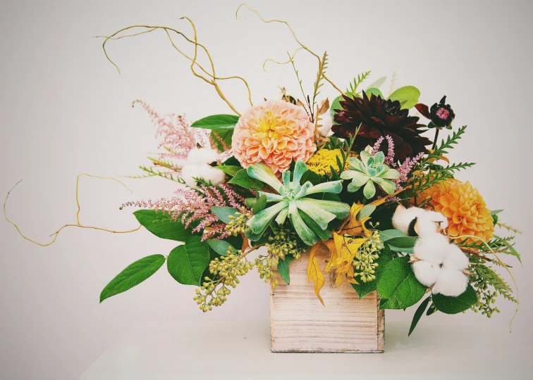 a vase filled with a colorful arrangement of flowers