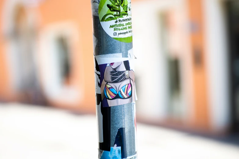 a pole has stickers on the top of it