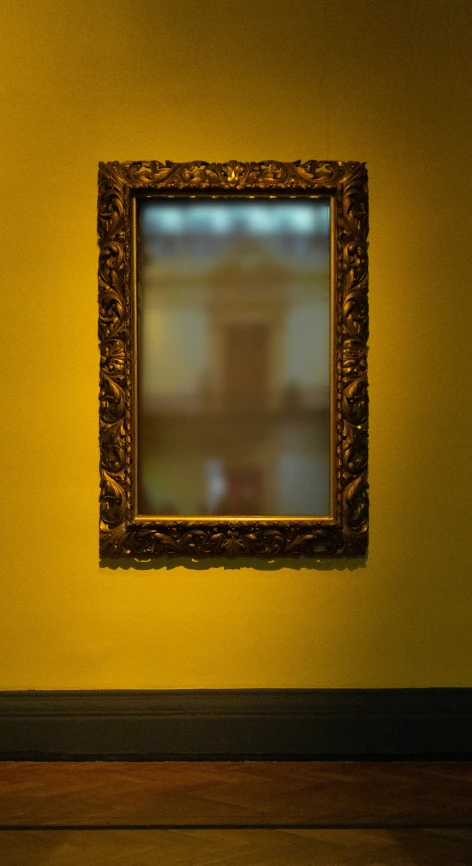 an old wooden frame hanging from a wall