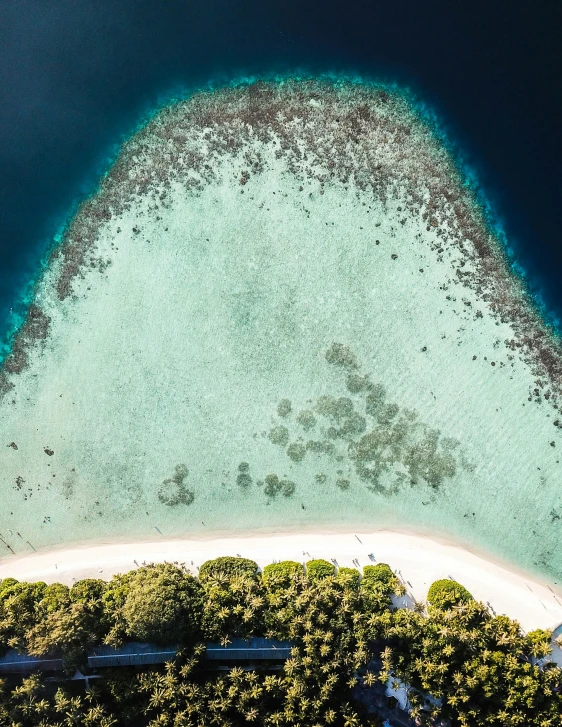 a view from the air looking at an island and beach