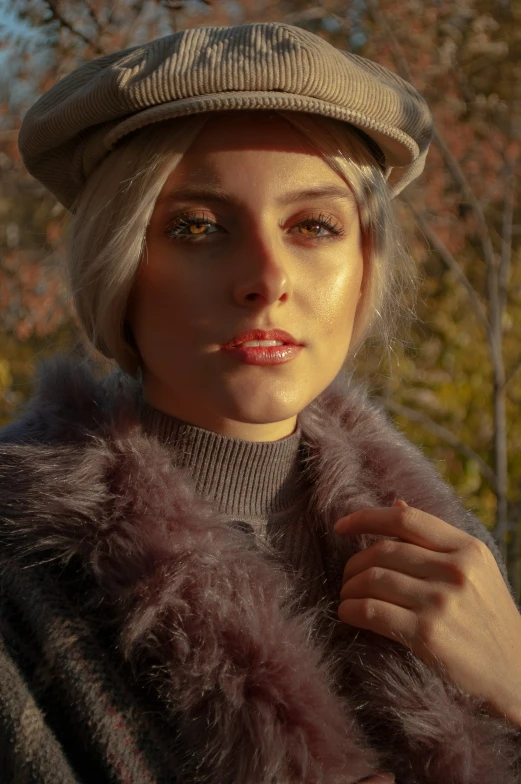 a woman with blonde hair wearing a hat and fur coat