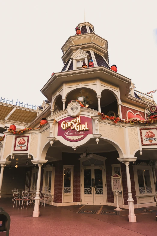 the building features a tower and has many clocks