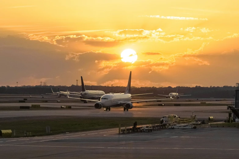 two airplanes that are sitting on a tarmac