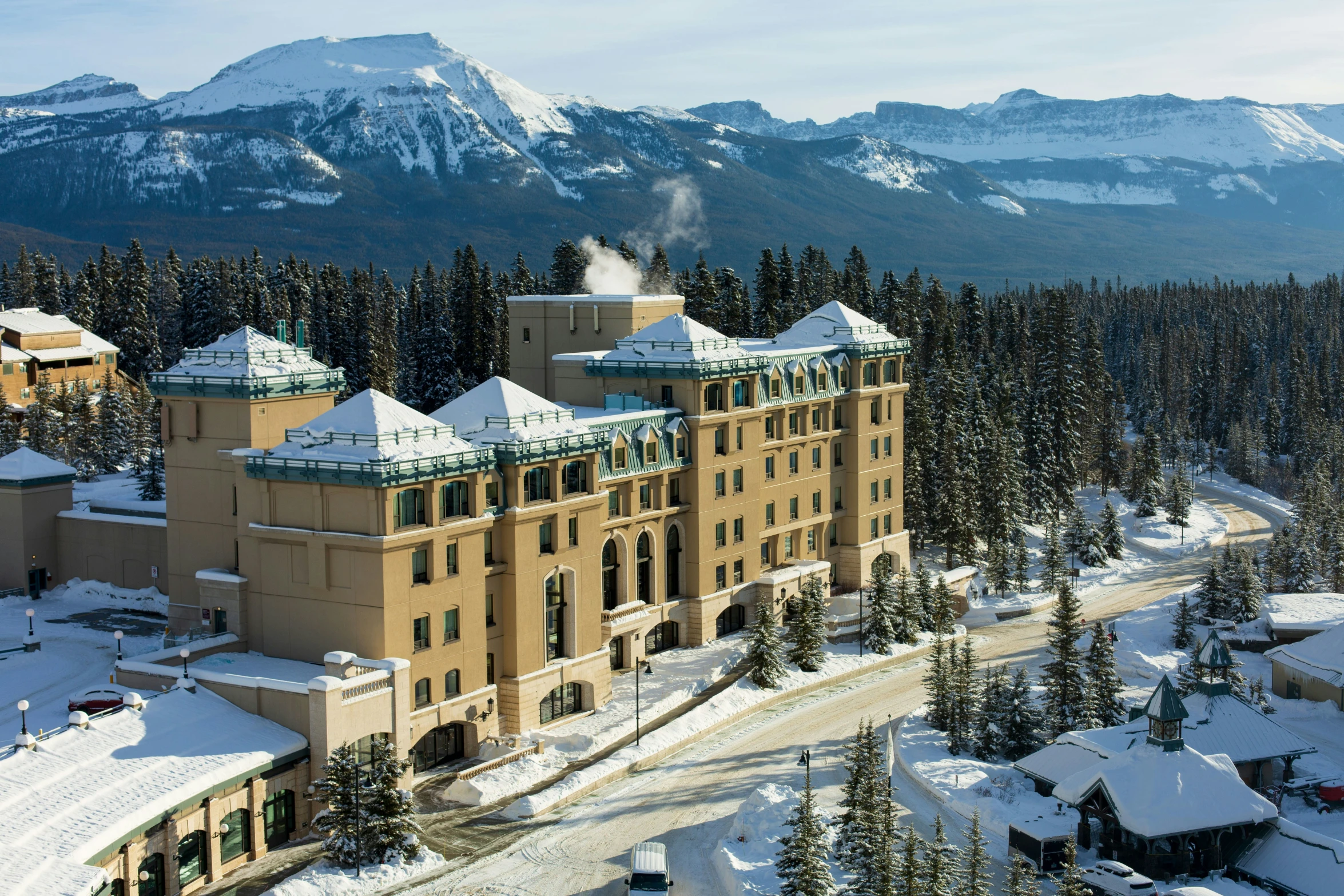 an old building in the snow on a snowy mountain side