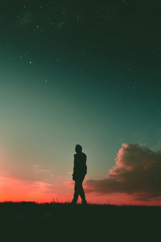 the silhouette of a man is shown at sunset