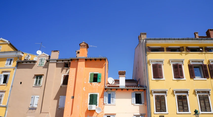 multiple buildings that look like they have shutters open