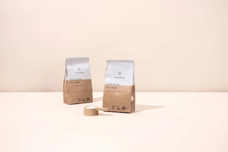 some coffee bags in front of a white background