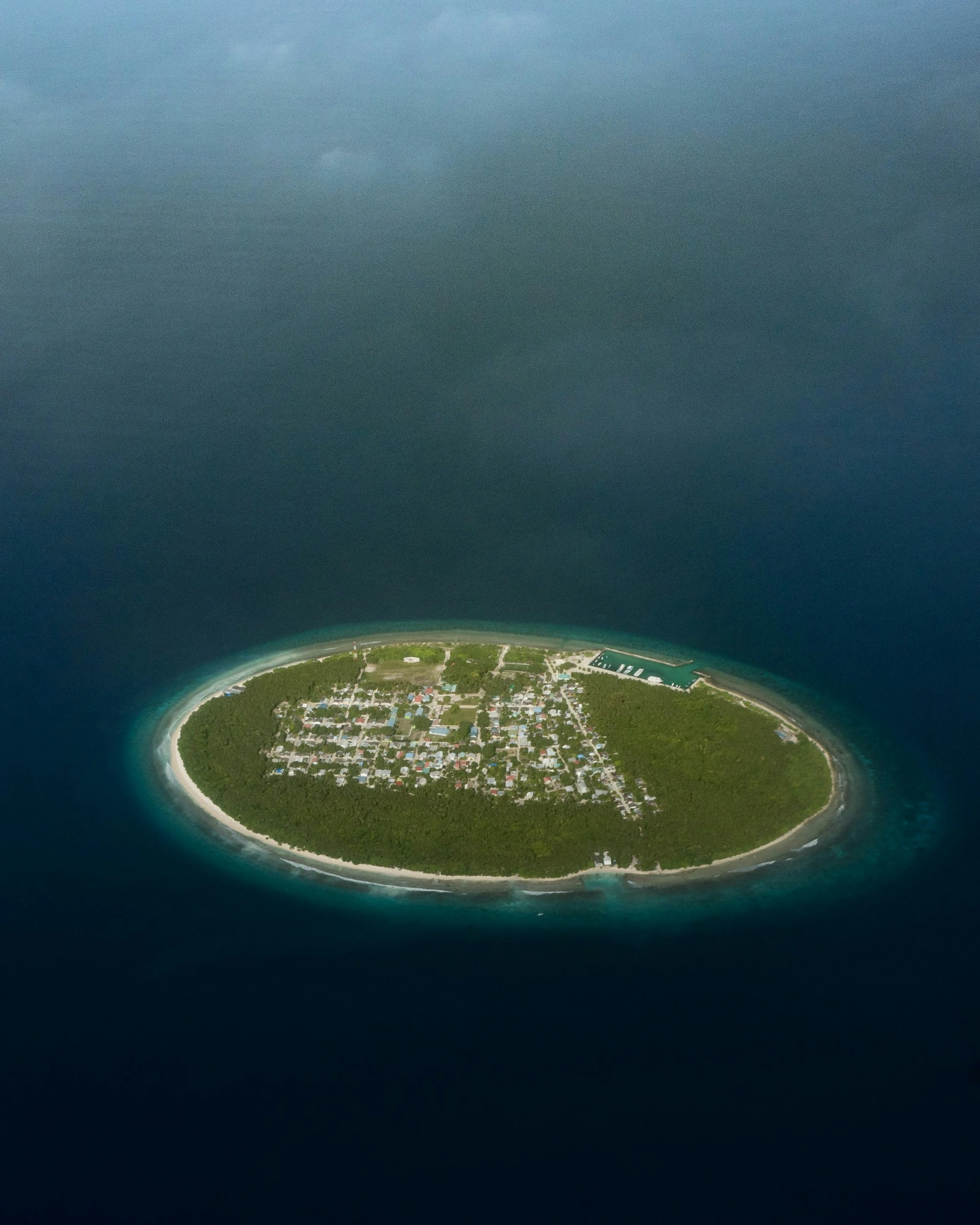 an aerial view of an island in the middle of the water