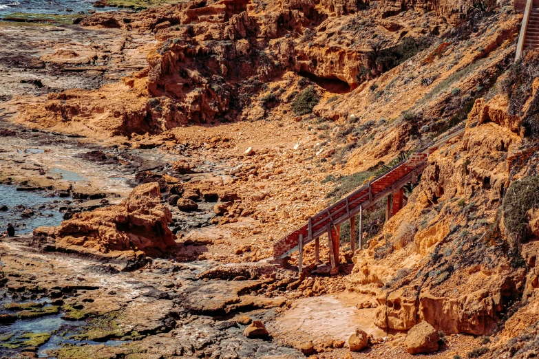 the train is going over a wooden bridge