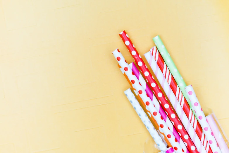 several colorful colored striped and polka dot party straws