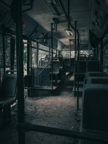 a long abandoned bus with no passengers inside