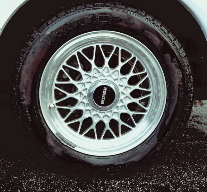 the front wheels of a white car