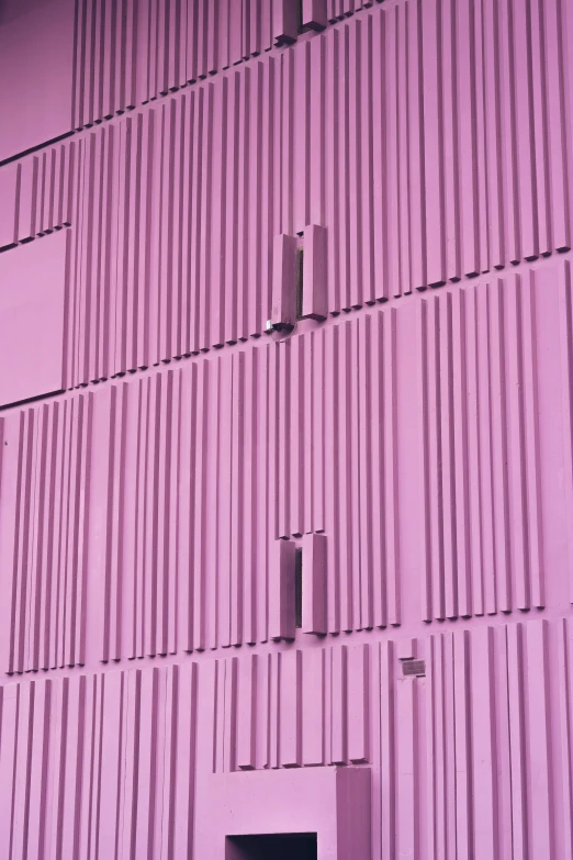 a purple wall with bars painted all over it