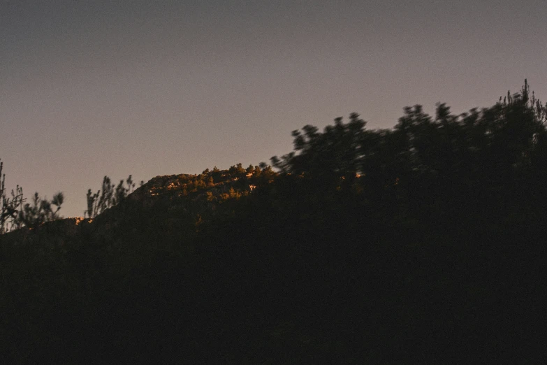 the view of the top of a hill at night