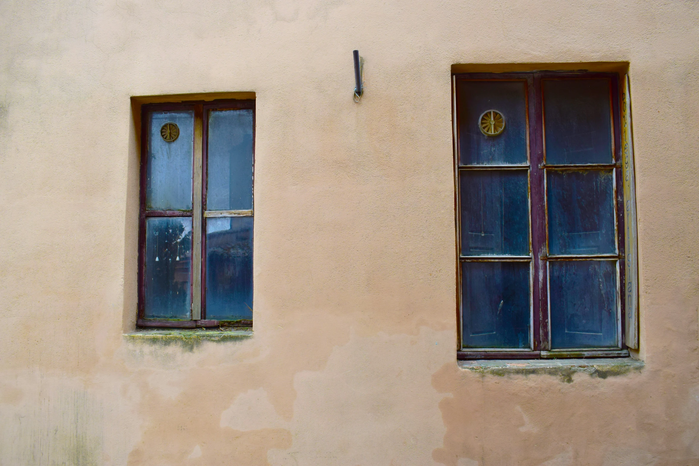 an image of two windows on the side of a building