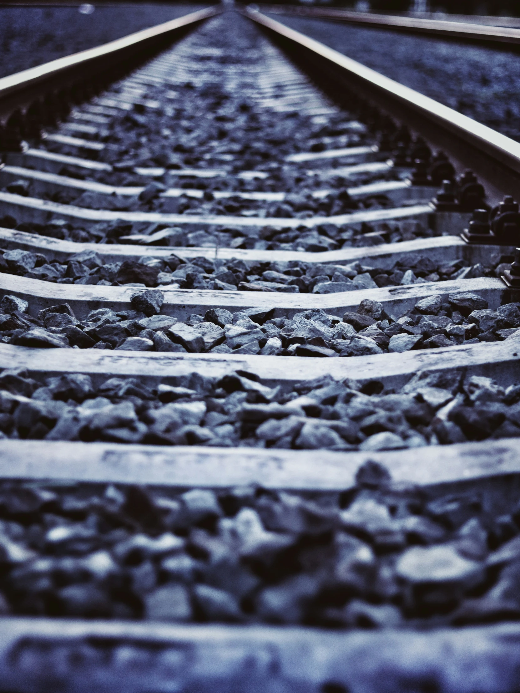 the end of a railway track in black and white