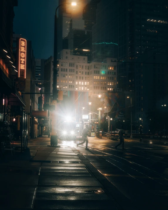 street scene in the middle of city at night