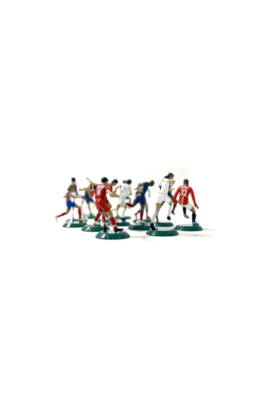 a group of miniature toy figurines wearing different sports attire