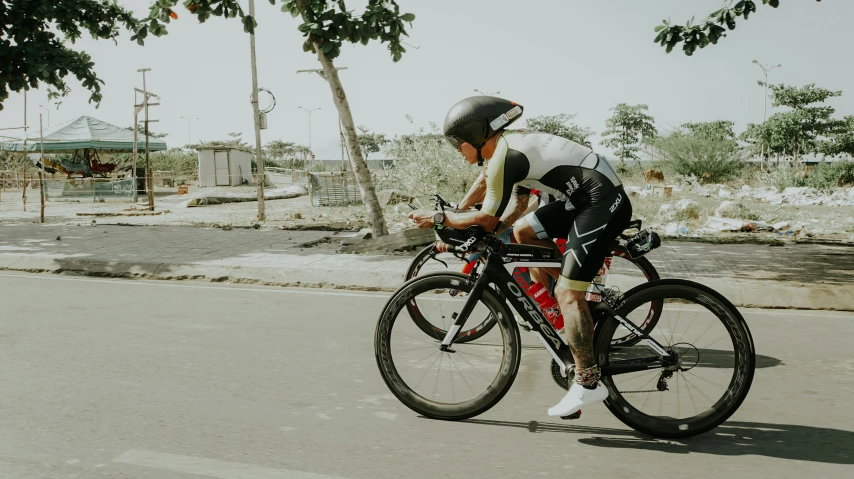 a man wearing a bike helmet on a street