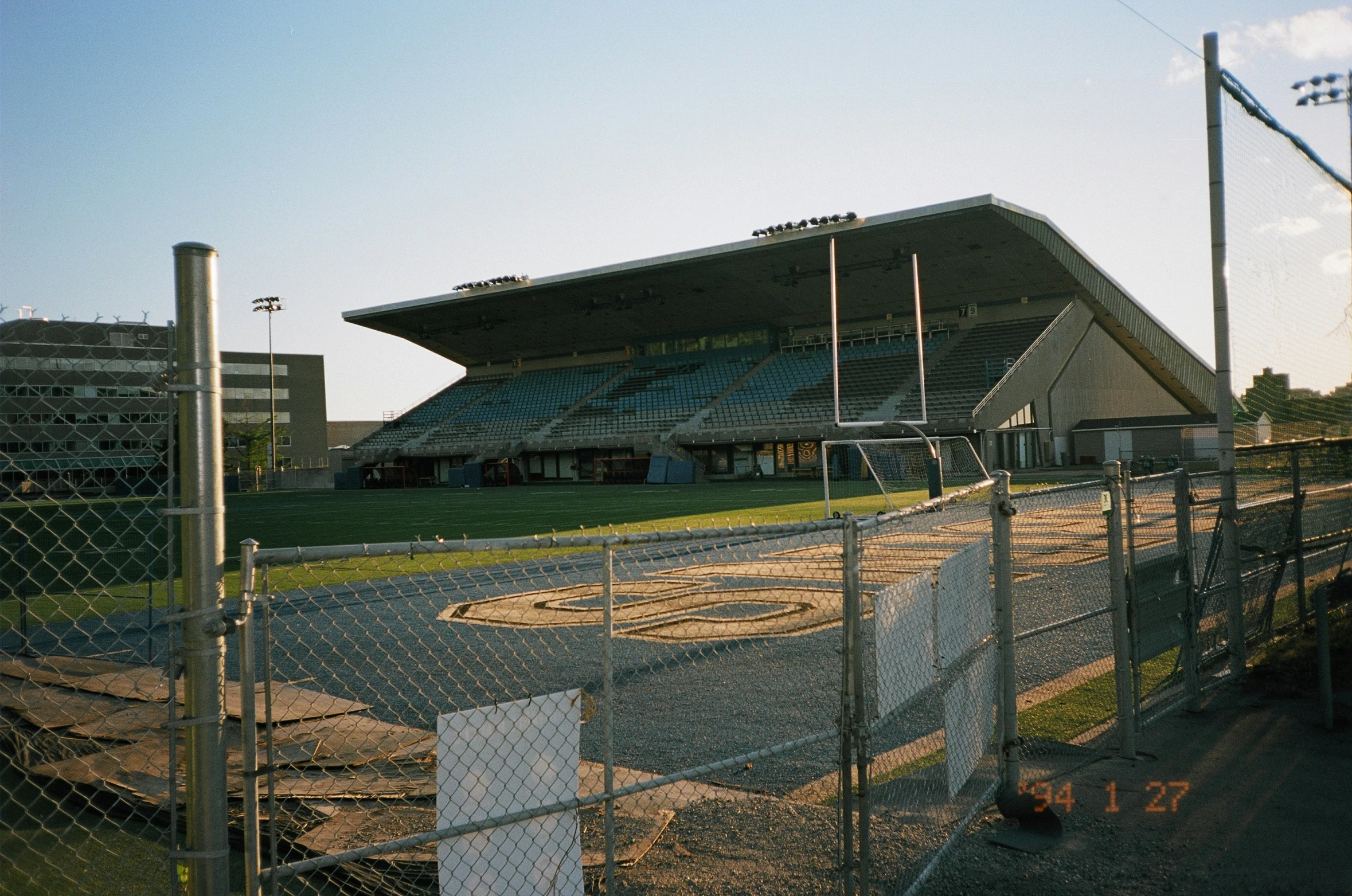 the sun is coming down on a soccer field