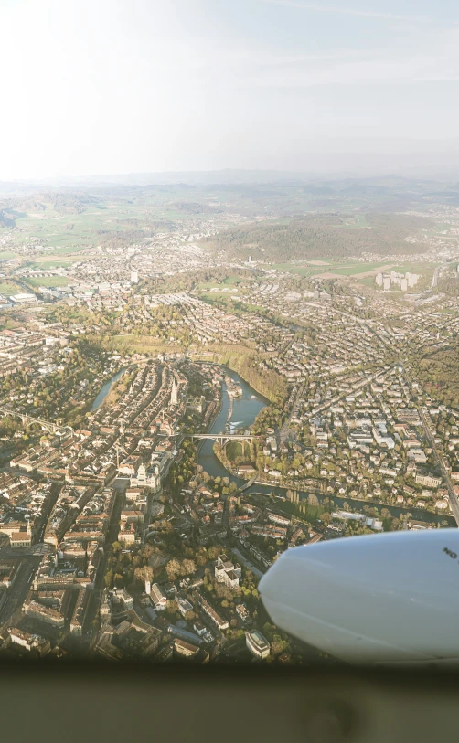 a large city from an airplane on a sunny day