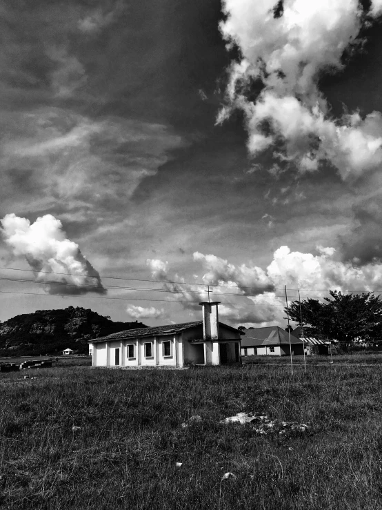 black and white pograph of an old church in the countryside