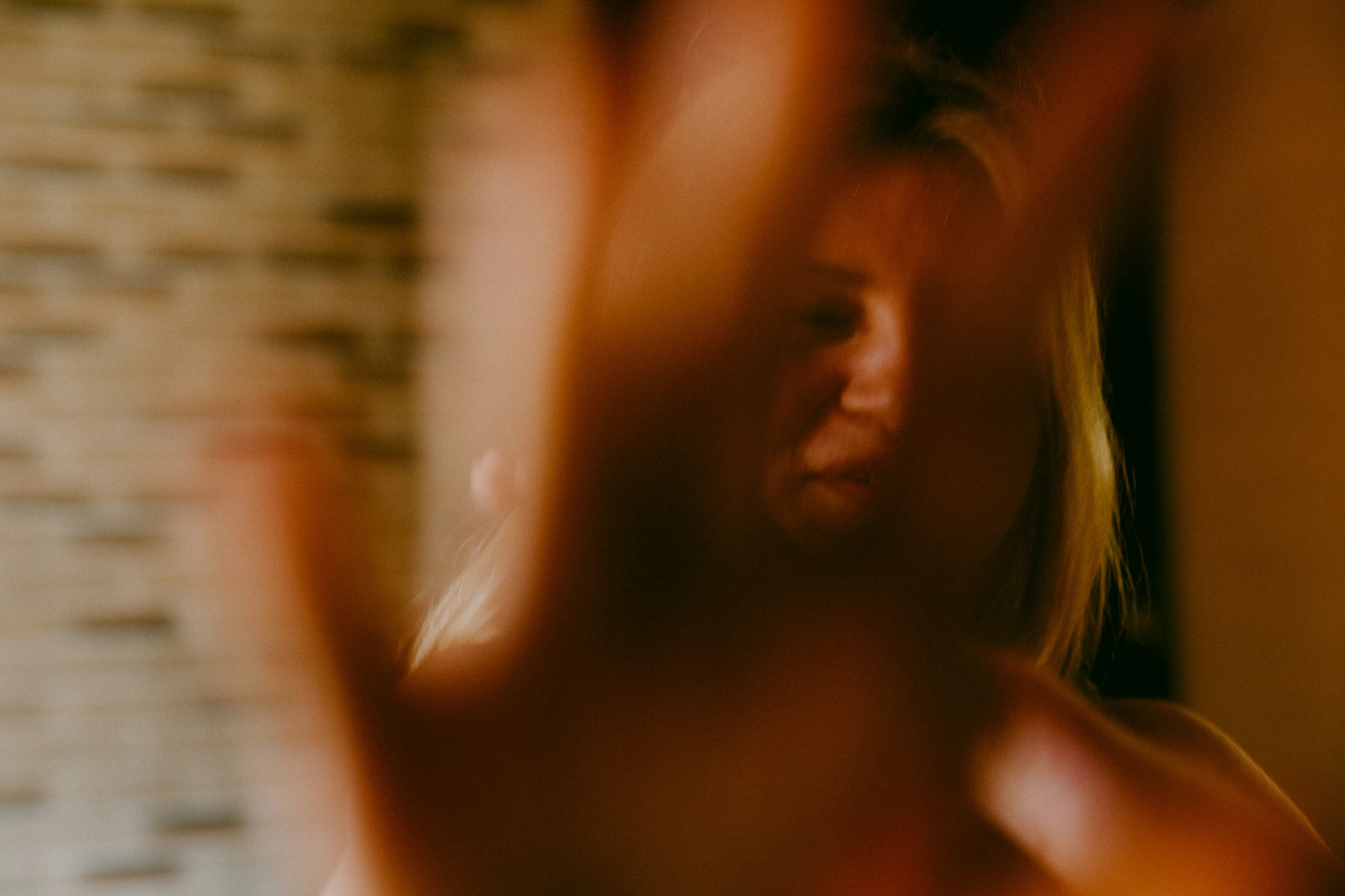 blurred pograph of a woman holding a cell phone to her ear