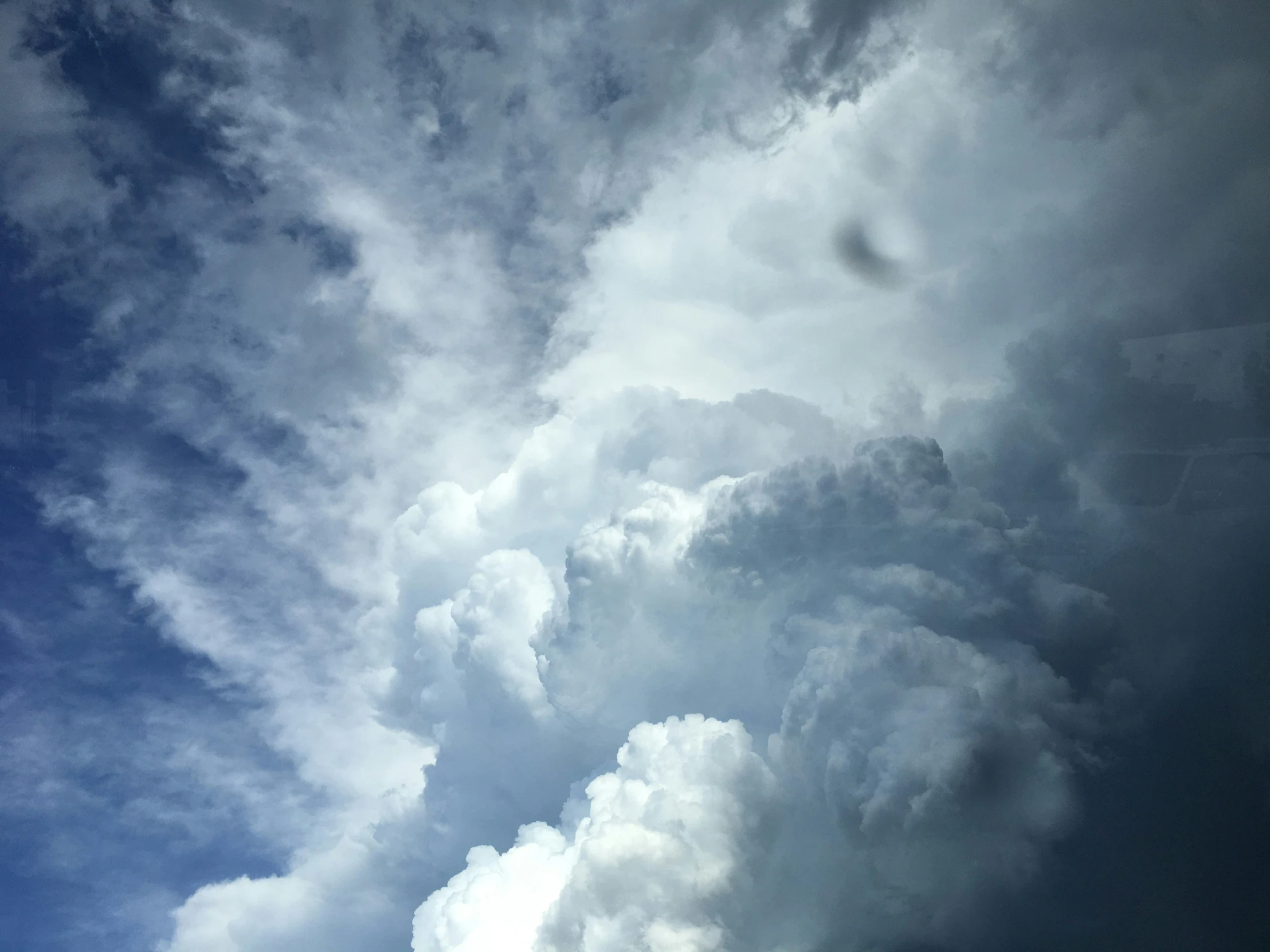 a bunch of large white clouds in the sky