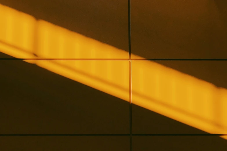 shadow cast by light of an object mounted on a wall