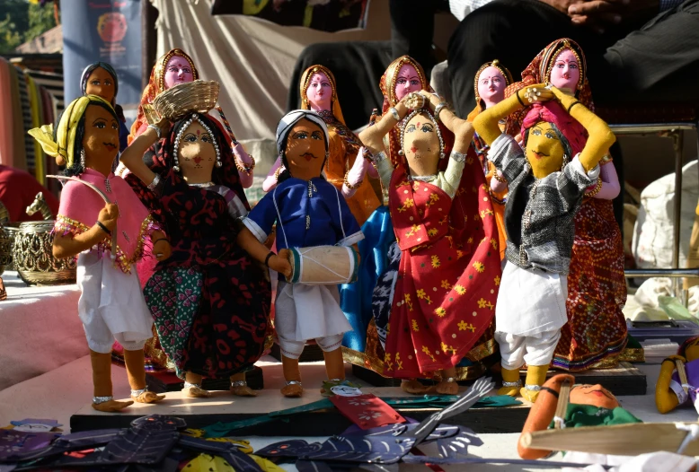 a group of figurines that are wearing head dresses