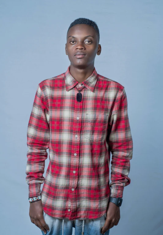 an african male wearing a red checked on up shirt